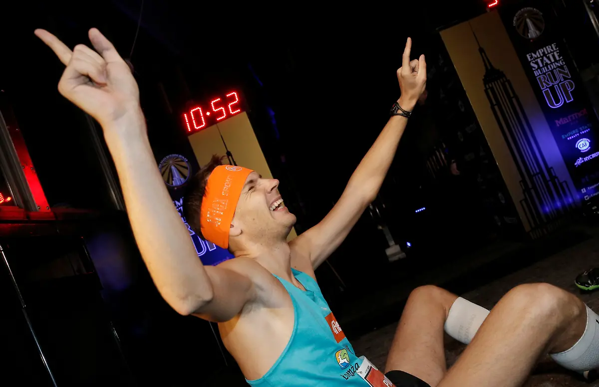 Piotr-Lobodzinski-of-Poland-celebrates-after-crossing-the-finish-line-on-the-86th-floor-observation-deck-after-running-up-the-86-flights-1-576-stairs-of-the-Empire-State-Building-to-win-the-2017-Empire-State-Building-Run-up-race-in-New-York-February-1-2017