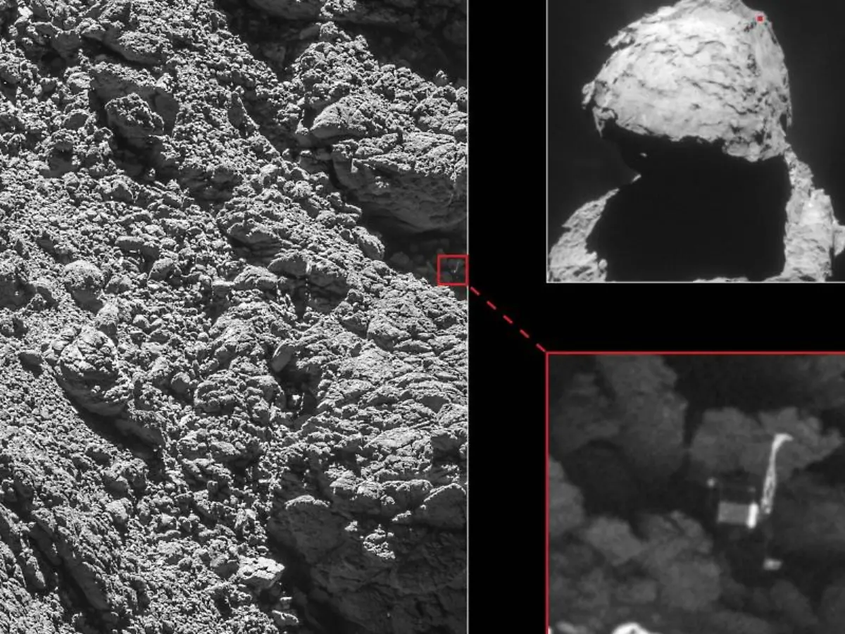Der-Hochleistungskamera-Osiris-an-Bord-der-Raumsonde-Rosetta-gelang-es-ein-Foto-des-Landeroboters-Philae-zu-machen-der-auf-dem-Kometen-Tschuri-in-einem-dunklen-Spalt-festhaengt