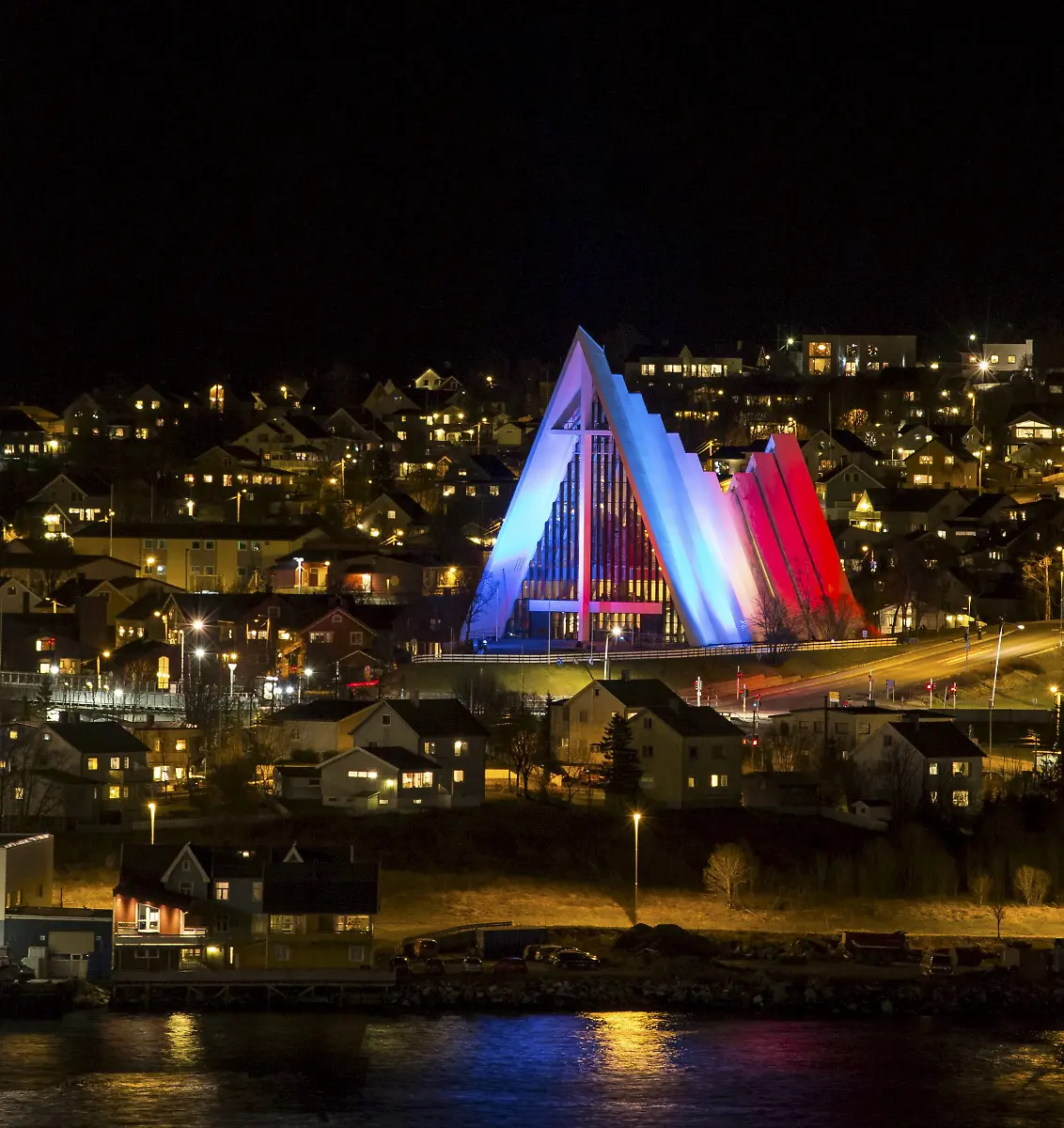 The-Arctic-Cathedral-is-illuminated-in-the-French-national-colors-in-Tromso-Norway