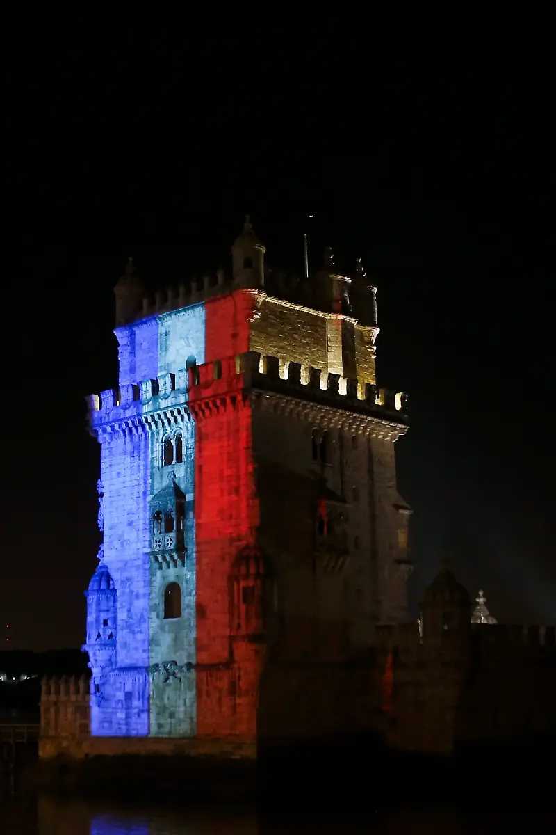 The-Belem-Tower-is-illuminated-in-the-French-national-colours-in-tribute-to-the-victims-of-the-13-November-Paris-terrorist-attacks-in-Lisbon-Portugal