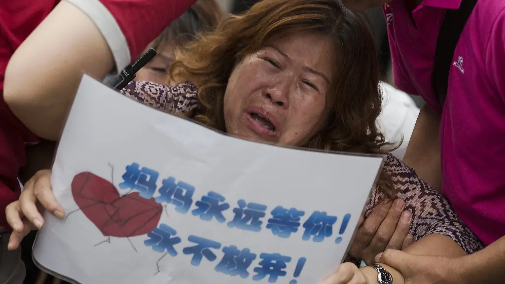 2015-08-07T102814Z-1609504959-GF20000016554-RTRMADP-3-MALAYSIA-AIRLINES-CRASH-CHINA-JPG657697391077131802