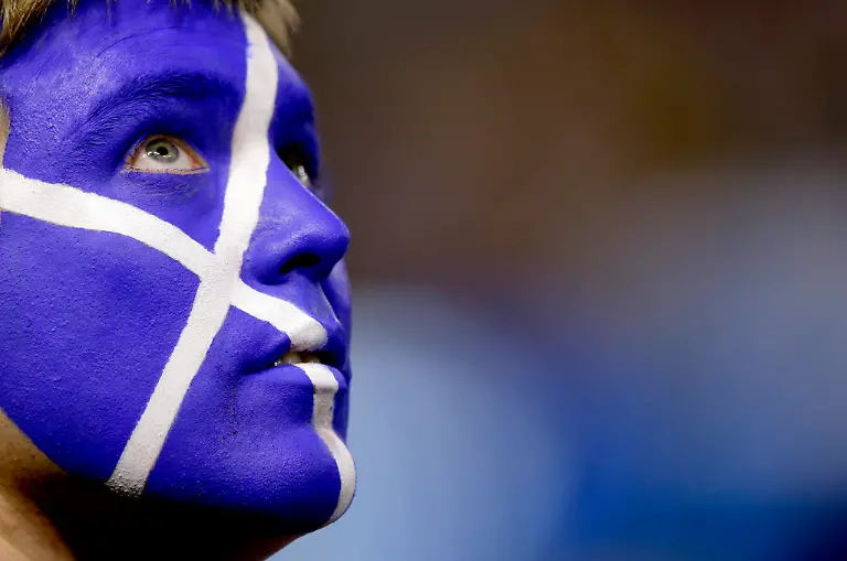 A-supporter-of-Andy-Murray-of-Great-Britain-with-the-Scotish-flag-painted-on-his-face-during-the-men-s-final-between-Murray-and-Novak-Djokovic-of-Serbia-at-the-Australian-Open-Grand-Slam-tennis-tournament-in-Melbourne-Australia-27-January-2013