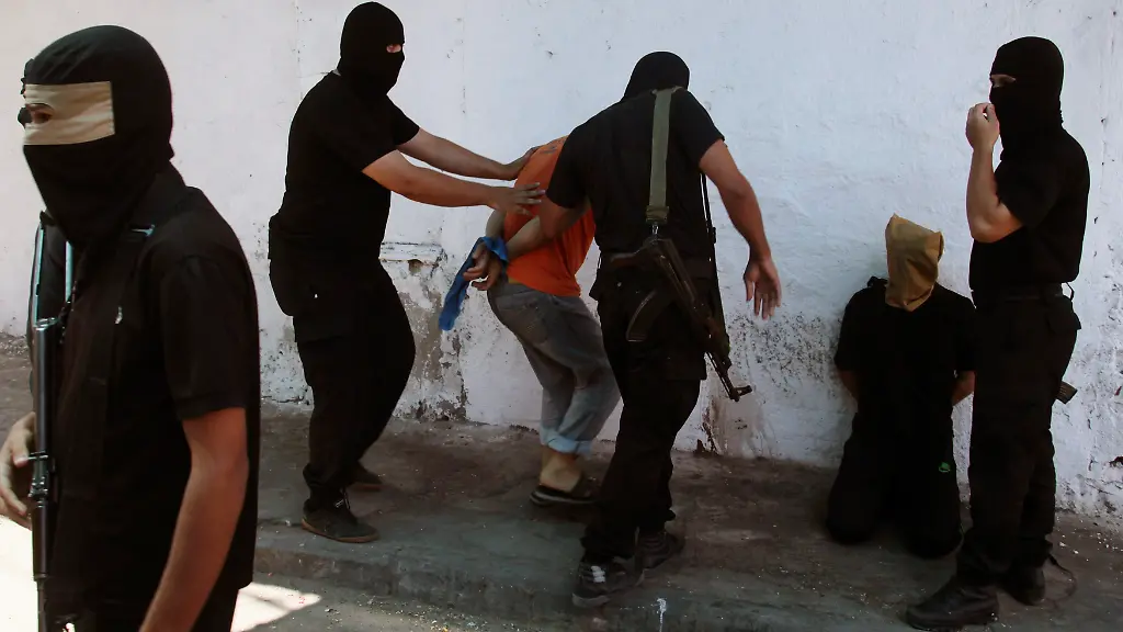 2014-08-22T121615Z-1517256307-GM1EA8M1JO301-RTRMADP-3-MIDEAST-GAZA-EXECUTIONS-JPG6899904796987390172