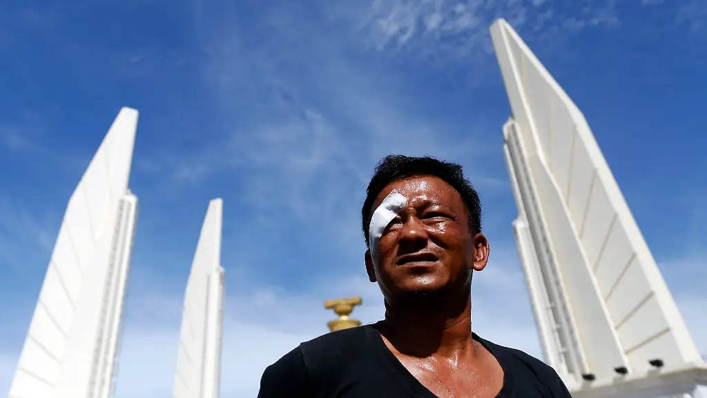 2014-05-15T033708Z-1425270001-GM1EA5F0W5T01-RTRMADP-3-THAILAND-PROTEST-JPG1370146273812430974