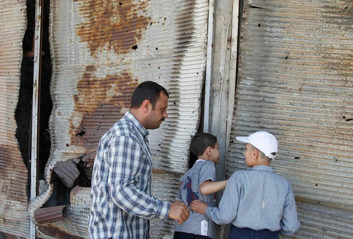 2014-05-09T161741Z-619819801-GM1EA591UGV01-RTRMADP-3-SYRIA-CRISIS-HOMS-JPG6160247559446352686