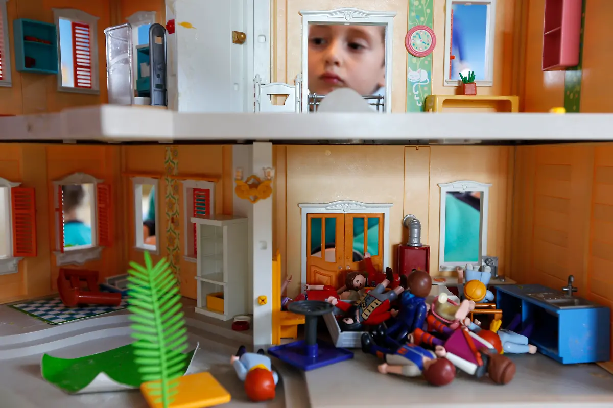 A-child-plays-with-a-Playmobil-house-and-figures-at-the-Playmobil-FunPark