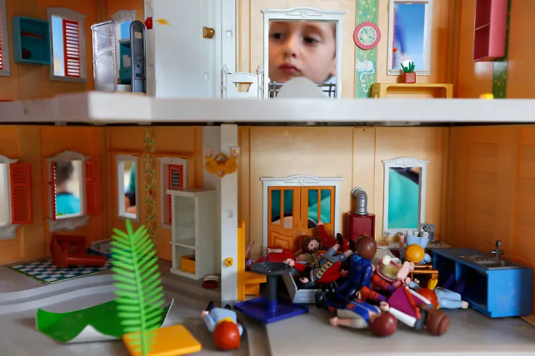 A-child-plays-with-a-Playmobil-house-and-figures-at-the-Playmobil-FunPark