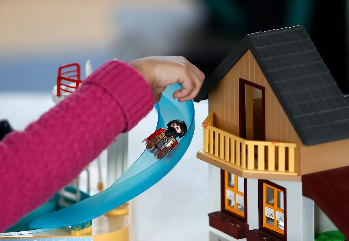 A-child-plays-with-a-Playmobil-figure-at-the-Playmobil-FunPark