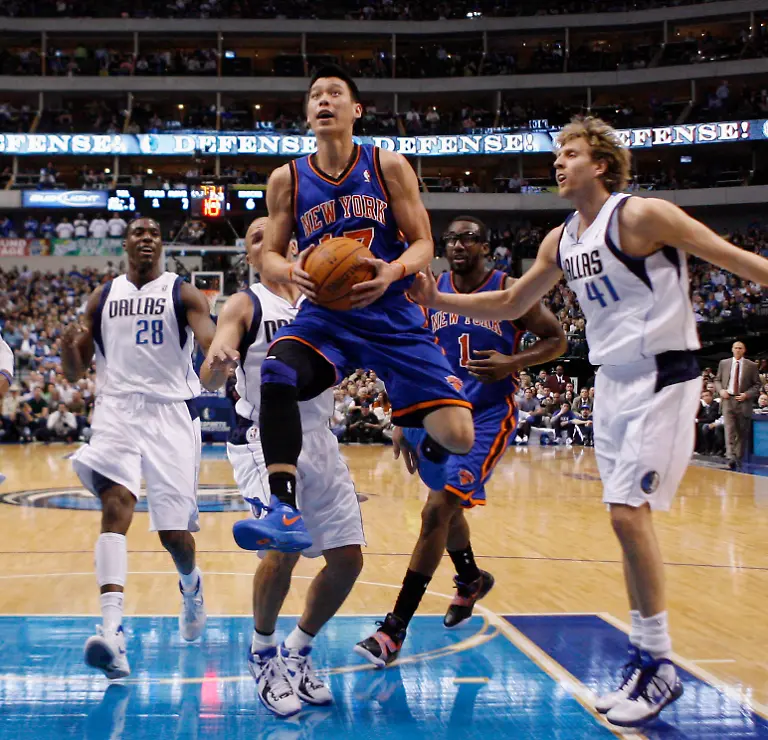 New-York-Knicks-guard-Jeremy-Lin-C-drives-to-the-basket-near-Dallas-Mavericks-center-Ian-Mahinmi-L-guard-Jason-Kidd-2nd-L-and-forward-Dirk-Nowitzki-R-during-the-first-half-of-their-NBA-basketball-game-in-Dallas-Texas-March-6-2012-Also-seen-is-Knicks-Amar-e-Stoudemire-1