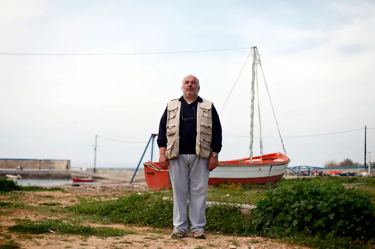 Nick-Boudas-54-a-bread-delivery-man-poses-for-a-picture-near-the-village-of-Filiatra-March-23-2012-When-asked-how-he-had-been-affected-by-the-economic-crisis-Boudas-replied-I-lost-my-job-I-lost-everything-Picture-taken-March-23-2012