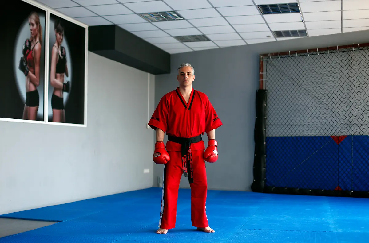 Aris-Christodoulou-39-a-martial-arts-instructor-poses-for-a-picture-in-his-gymnasium-in-Athens-March-28-2012-When-asked-how-he-had-been-affected-by-the-economic-crisis-Christodoulou-replied-My-clients-cannot-meet-the-subscription-fees-and-me-and-my-partners-aren-t-taking-a-wage-Picture-taken-March-28-2012