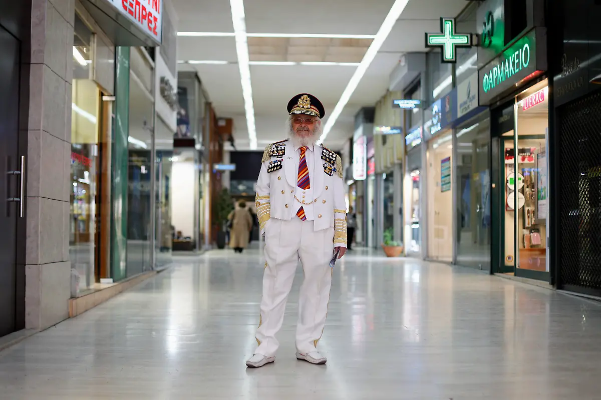 Christos-Vassiliou-79-retired-sausage-maker-poses-for-a-picture-in-a-shopping-centre-in-central-Athens-March-28-2012-When-asked-how-he-had-been-affected-by-the-economic-crisis-Vassiliou-replied-my-pension-has-been-cut-by-250-euros-334-a-month-If-it-continues-like-this-I-will-be-thrown-out-of-my-house-because-I-can-t-afford-my-rent-Picture-taken-March-28-2012