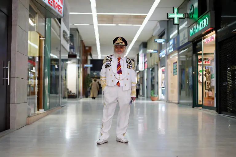 Christos-Vassiliou-79-retired-sausage-maker-poses-for-a-picture-in-a-shopping-centre-in-central-Athens-March-28-2012-When-asked-how-he-had-been-affected-by-the-economic-crisis-Vassiliou-replied-my-pension-has-been-cut-by-250-euros-334-a-month-If-it-continues-like-this-I-will-be-thrown-out-of-my-house-because-I-can-t-afford-my-rent-Picture-taken-March-28-2012
