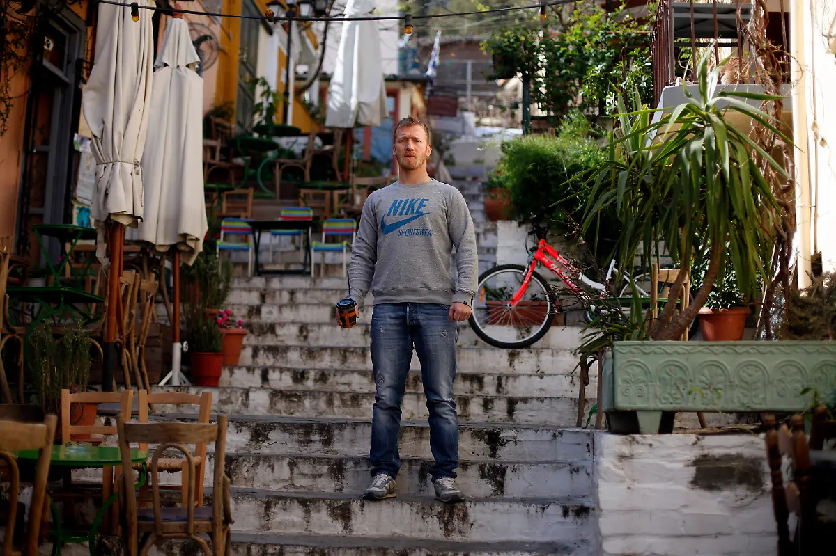 Dimitris-Kazakos-31-a-waiter-poses-for-a-picture-in-the-Placa-area-of-Athens-March-28-2012-When-asked-how-he-had-been-affected-by-the-economic-crisis-Kazakos-replied-It-s-dramatically-changed-my-life-People-think-twice-about-eating-out-and-leaving-a-tip-Picture-taken-March-28-2012
