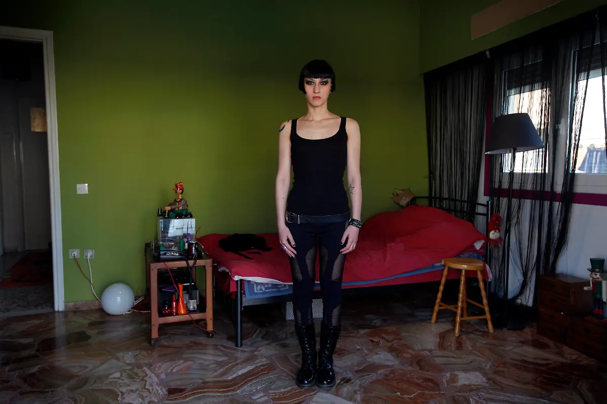 Christina-Tchatchou-30-an-actress-singer-poses-for-a-picture-in-her-bedroom-in-Athens-March-27-2012-When-asked-how-she-had-been-affected-by-the-economic-crisis-Tchatchou-replied-I-haven-t-been-that-affected-as-I-didn-t-get-paid-that-much-before-anyway-However-I-get-less-work-than-I-did-Picture-taken-March-27-2012