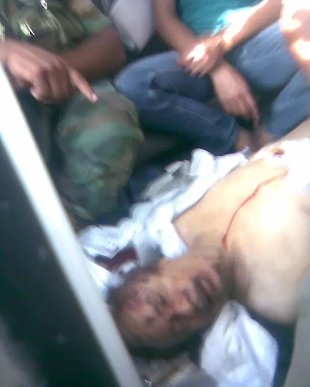 2011-10-20T162435Z-01-SIN186-RTRMDNP-3-GADDAFI-BODY-JPG901017490941327998