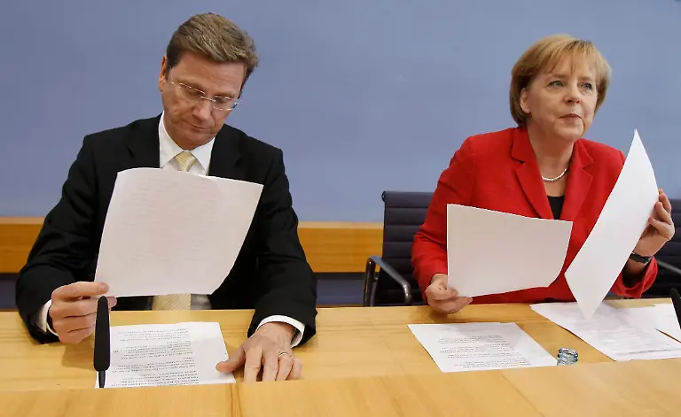 2010-06-07T131012Z-01-BER02-RTRMDNP-3-GERMANY-MERKEL-BUDGET-JPG7829511812532443004