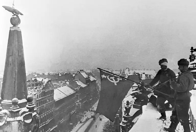 309244019-jpg-Budapest-Hungary-Soviet-soldiers-raise-a-Red-Banner-on-the-roof-of-a-building-in-the-city-liberated-from-Nazis-during-the-Second-World-War
