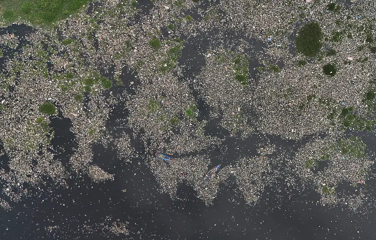 2024-06-13T121451Z-557271635-RC28A8AEI32R-RTRMADP-3-INDONESIA-ENVIRONMENT-RIVER