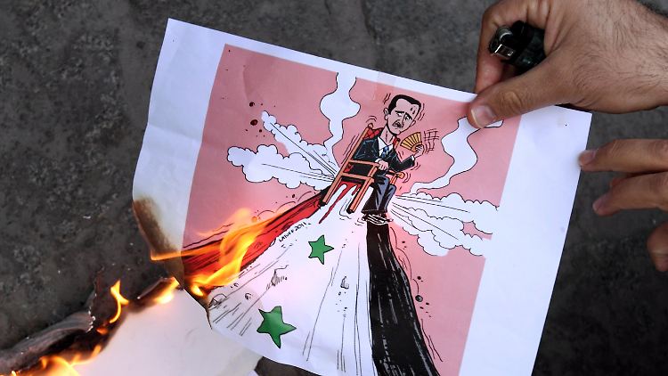 Exil-Syrer in der ganzen Welt demonstrieren - und hoffen auf ein Ende Assads.