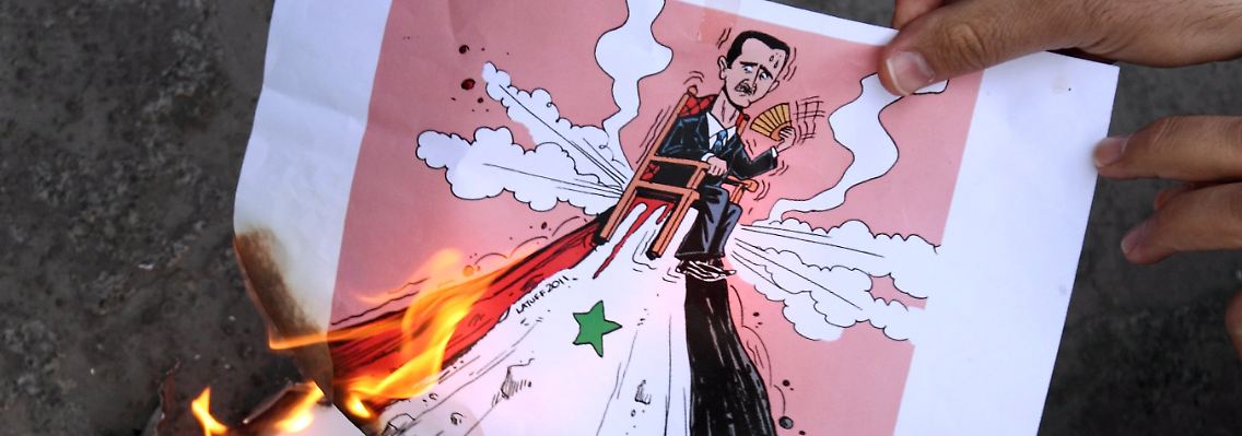 Exil-Syrer in der ganzen Welt demonstrieren - und hoffen auf ein Ende Assads.