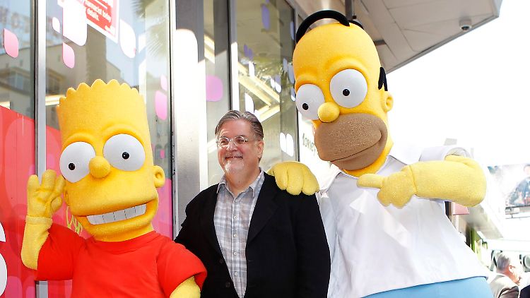 Matt Groening mit seinen Schöpfungen Bart und Homer.