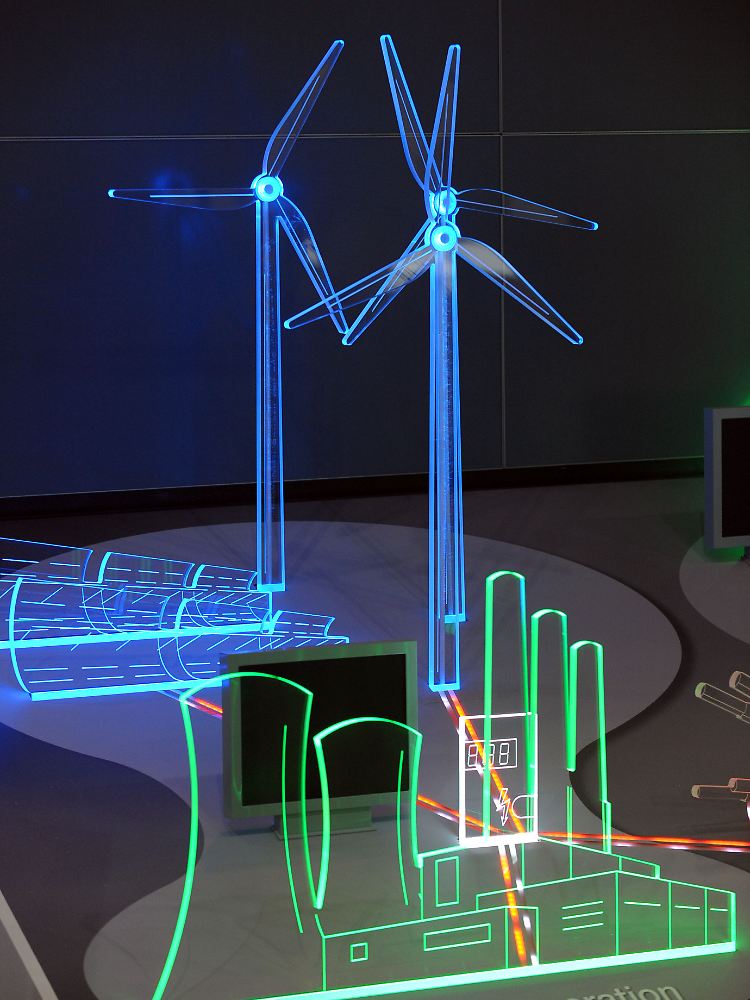 Modell einer Windkraftanlage und eines Atomkraftwerkes auf dem Stand der Firma ABB auf dem Messegelände für die Hannover Messe 2011.