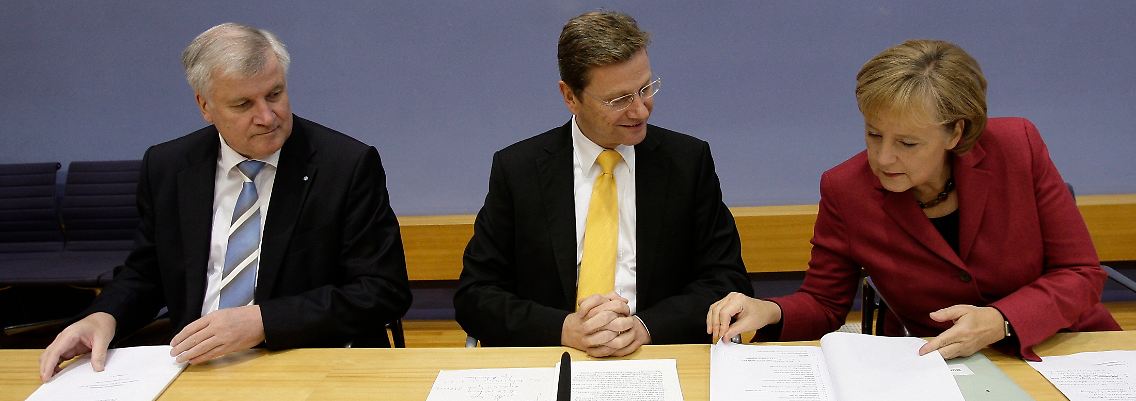 Seehofer, Westerwelle und Merkel: Das Werk ist vollbracht.