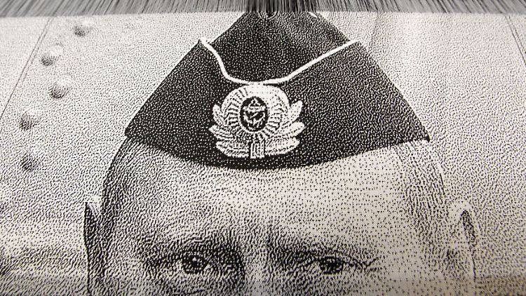 "Heldenhafte" Maschinenarbeit: ein gewebter Putin.