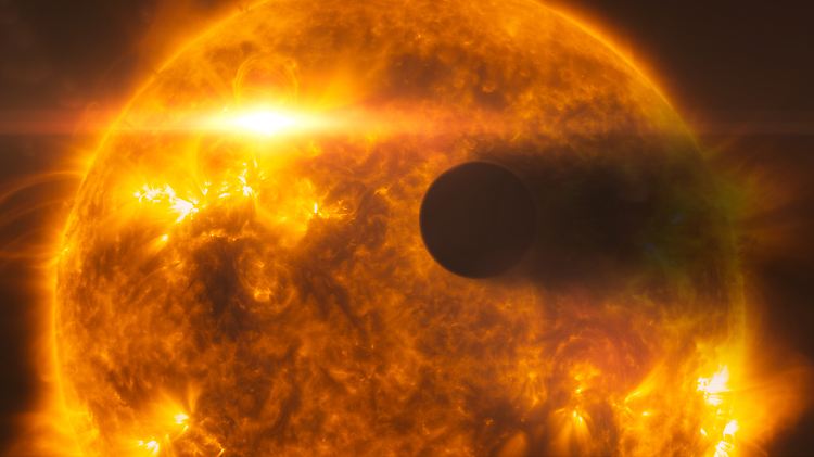 Eine "Hubble"-Aufnahme des Exoplaneten HD 189733b, der um seinen Heimatstern kreist und dabei eine Dampfwolke hinter sich herzieht.