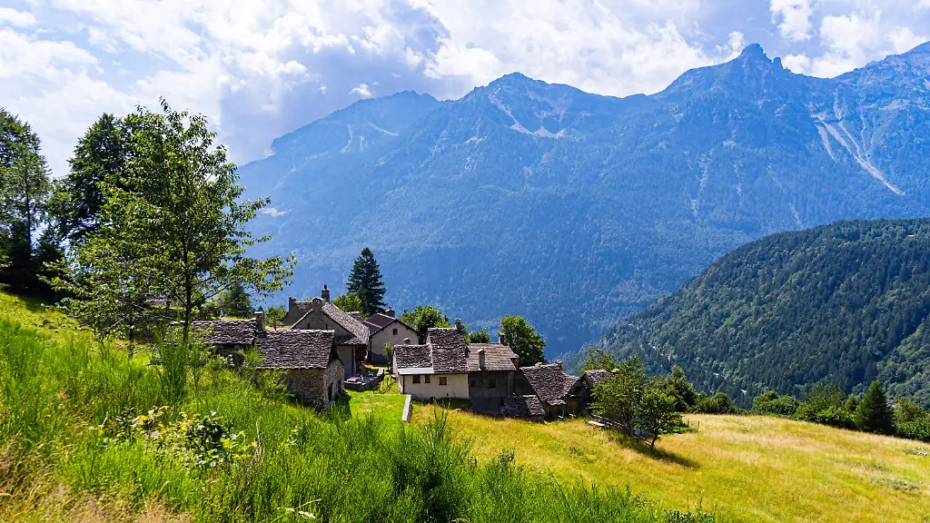 AFP-20230928-1372-21-v1-HighRes-IdyllicAlpineVillageOnAGreenSlopeWithAnMountain