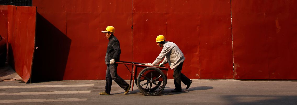 Eine Mahnung für kräftiges Wirtschaftswachstum: Chinesische Wanderarbeiter in Peking.