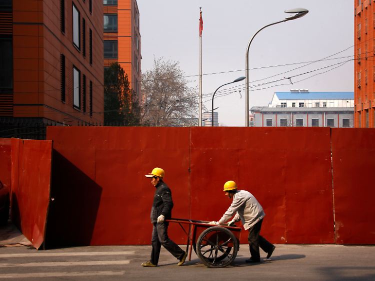 Eine Mahnung für kräftiges Wirtschaftswachstum: Chinesische Wanderarbeiter in Peking.
