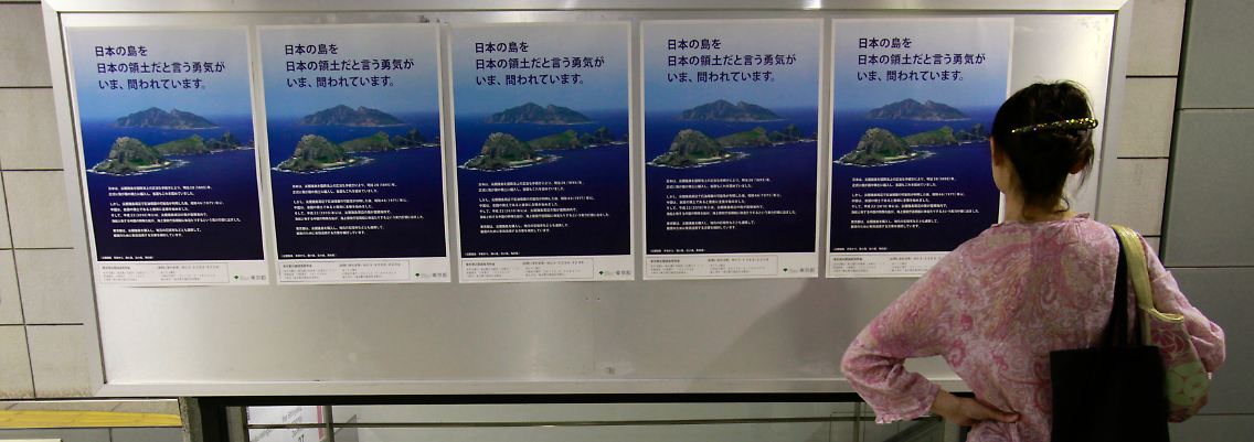 Insel-Informationen in der Tokioter U-Bahn: Populistische Kräfte verschärfen den Konflikt - auf allen Seiten.