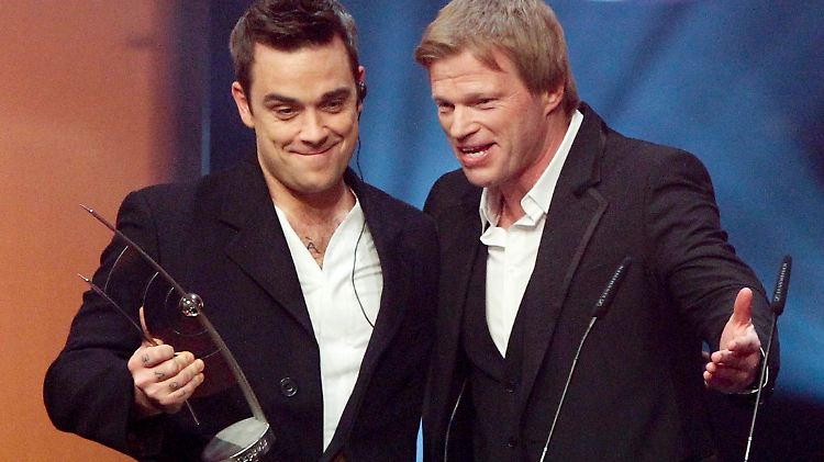 Wer ist hier der Titan? Oliver Kahn sucht offenbar neue Herausforderungen - hier mit Robbie Williams.