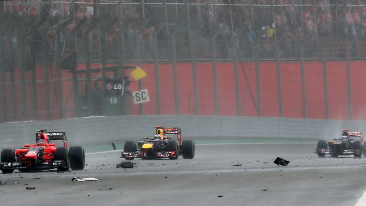 Durch Trümmer zum Titel. "Hinter dem Safety Car zu zittern und ins Ziel zu humpeln, war eine Qual", bekannte Vettel nach dem dramatischen Finale in Sao Paulo.