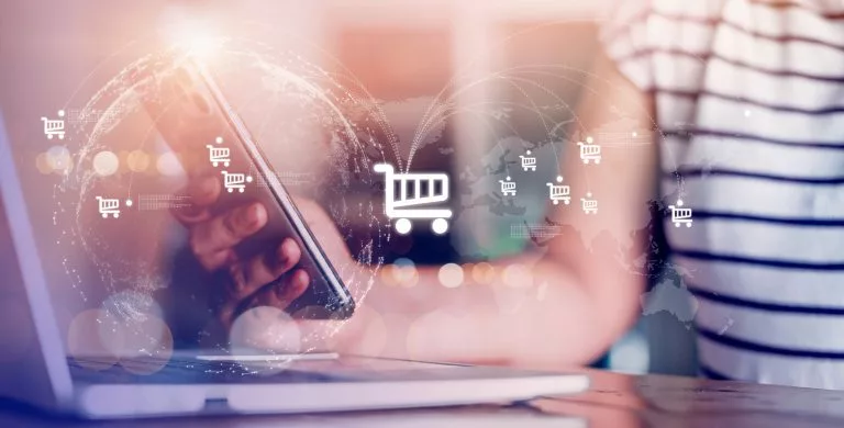 Businessman, woman using a smartphone, laptop to shop online Connect big data on the internet network to the world technology borderless shopping cart symbol